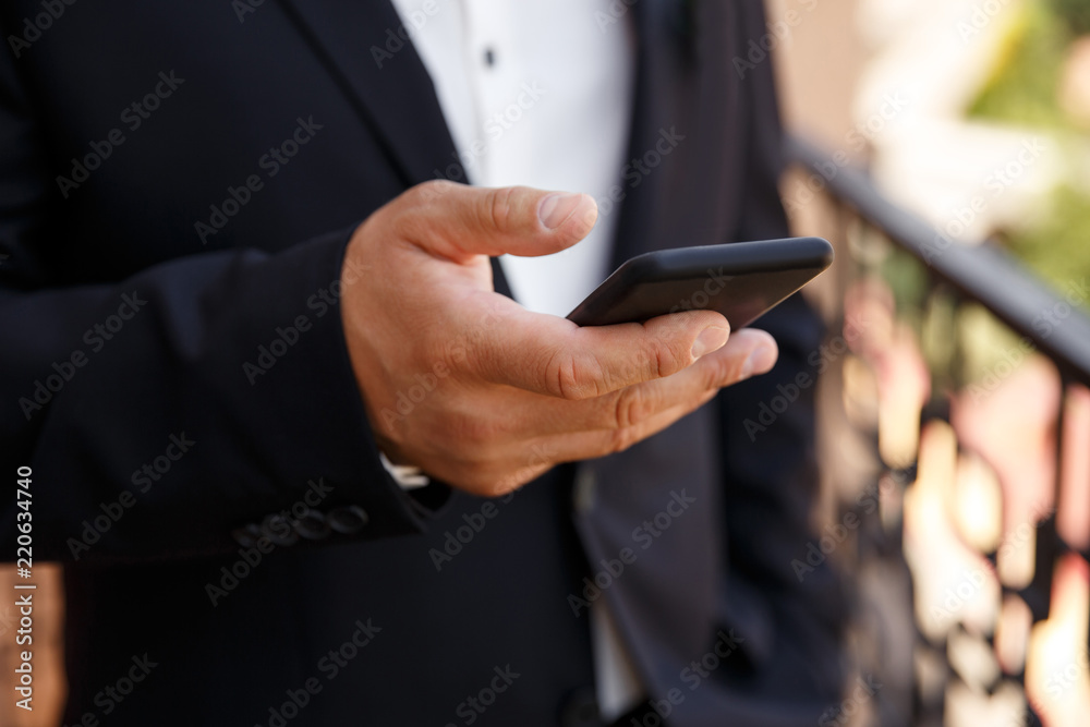 Man with smartphone. Businessman using a smart mobile phone Man with smartphone. Businessman using a smart mobile phone