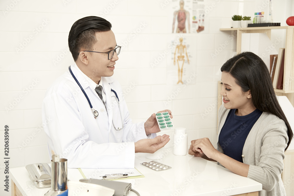 young mother is talking to a doctor young mother is talking to a doctor