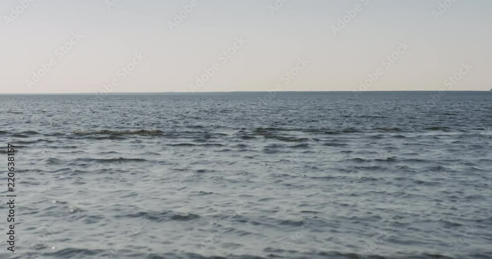 waves on a beach on a windy sunny day waves on a beach on a windy sunny day