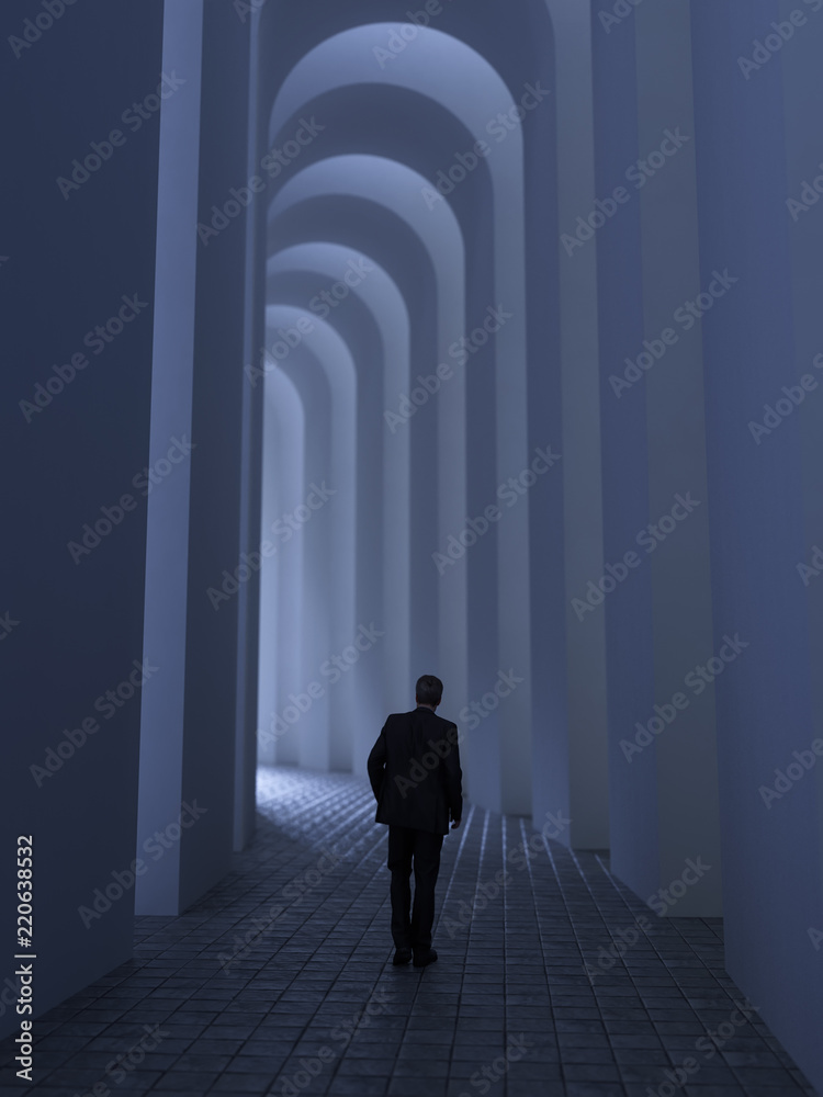 man walks through the archway