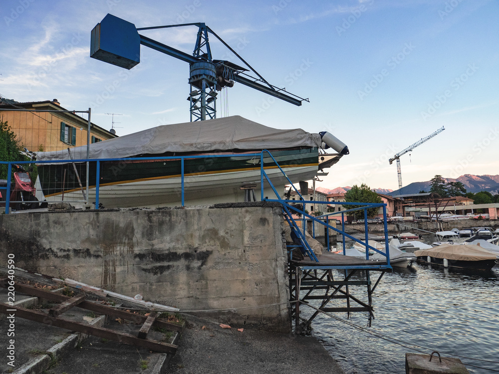 Fototapeta premium maintenance of sailing boats, motorboats and dinghies, Como lake. italy