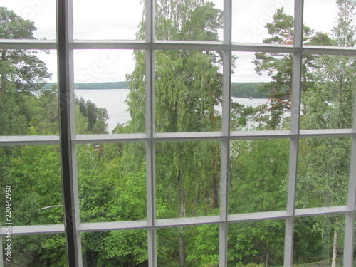 View from the window to the lake and the forest