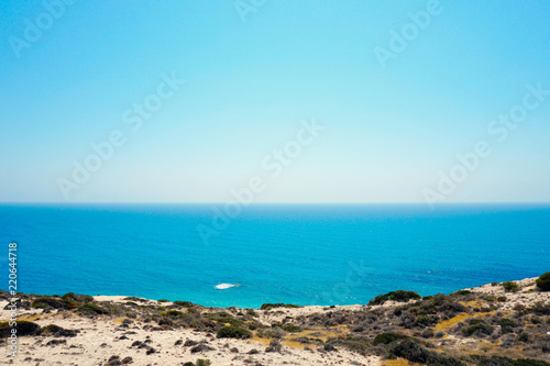 Beautiful view to the Mediterranean sea and blue clear sky from the shore in Cyprus in sunny summer day