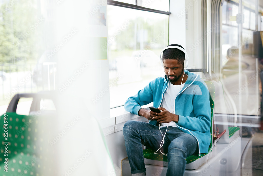 Man Riding In Bus Listening Music In Headphones - obrazy, fototapety, plakaty 