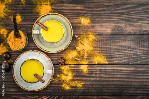 Traditional Indian drink turmeric milk photo