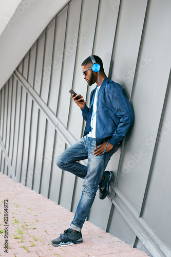 Fashion And Music. Man With Headphones And Phone In City © puhhha