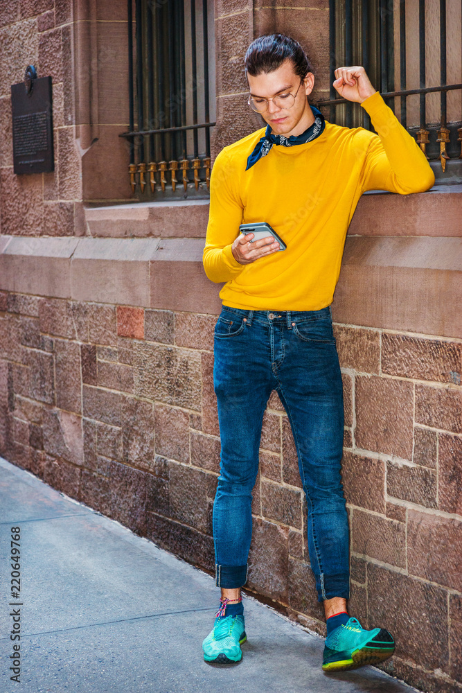 Young Hispanic American Man wearing glasses yellow long sleeve T
