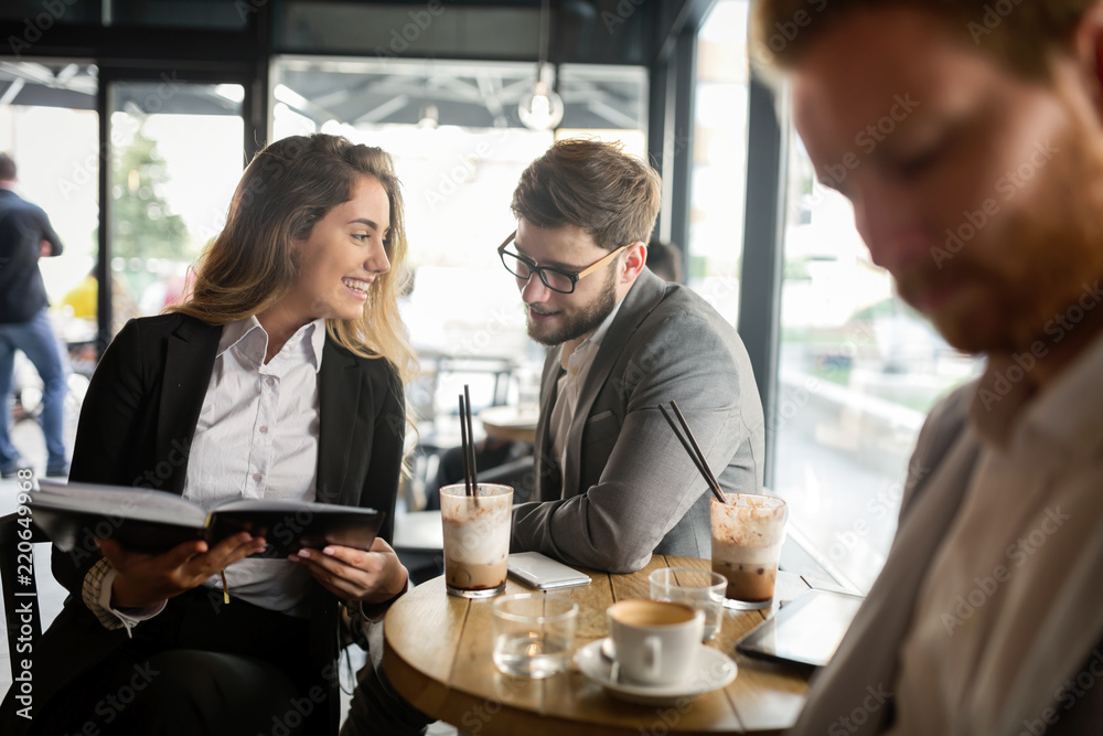 Business colleagues meeting at cafe