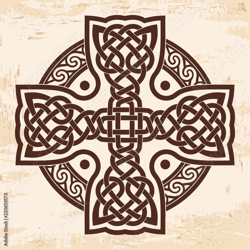 Celtic national cross with ornament interlaced ribbon. Image on a beige background with the effect of aging.