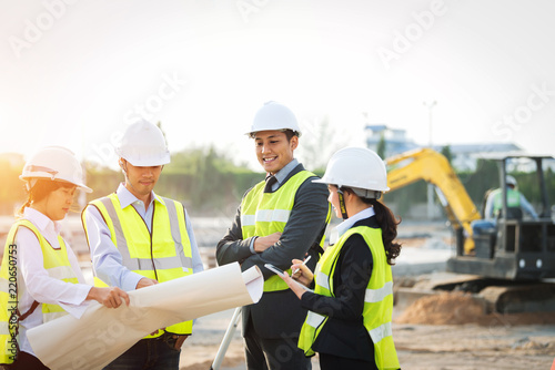 Construction manager architect checking plan