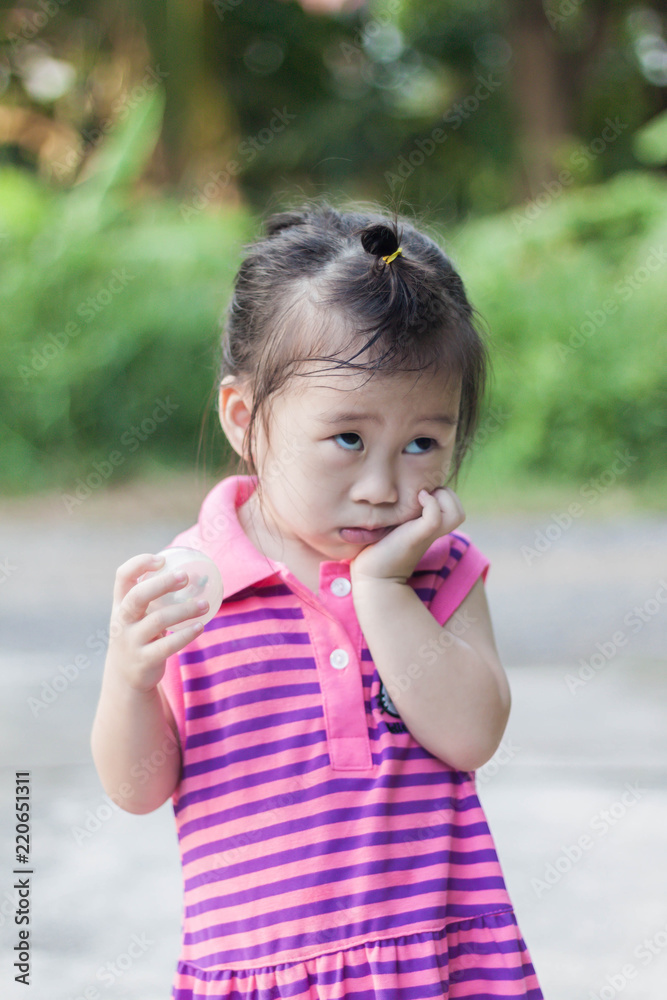 Close up Cute girl to act innocent wearing pink dress Close up Cute girl to act innocent wearing pink dress