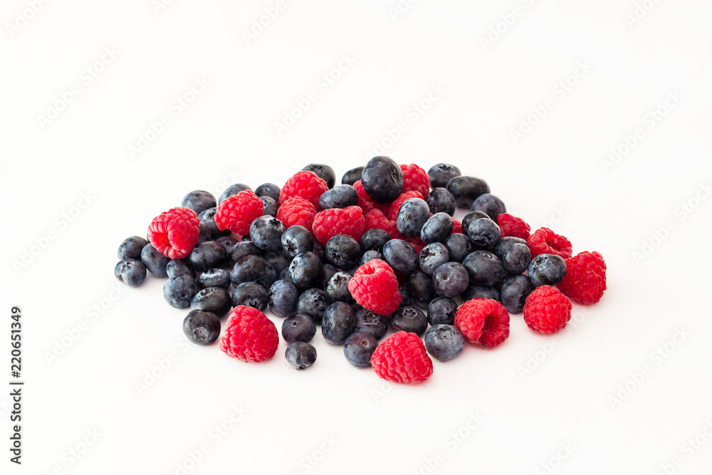 Blueberries and raspberries on white background. Blueberries and raspberries on white background.