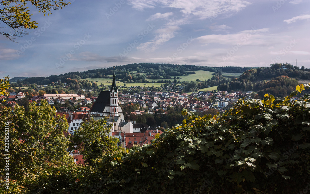 Panoramic view of Cesky Krumlov with church in Autumn