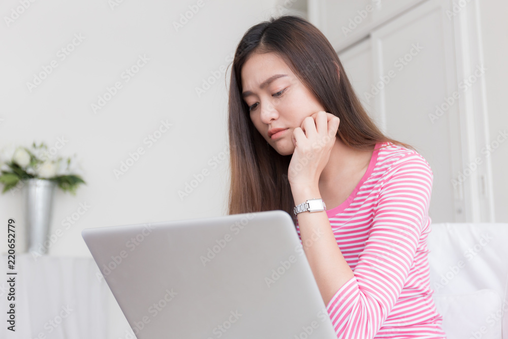 Asian women stressful working with a computer for a long time Asian women stressful working with a computer for a long time