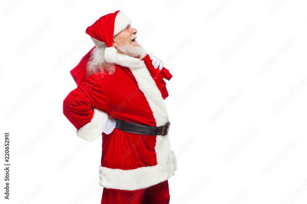 Christmas. Santa Claus is suffering from back pain and holds a red bag with gifts on his back. Isolated on white background. Christmas. Santa Claus is suffering from back pain and holds a red bag with gifts on his back. Isolated on white background.