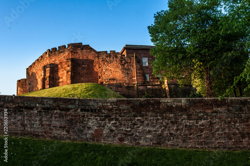 Chester medieval Castle at sunset, beyond the city wall. The castle and the walls are one of the major tourist attraction of the City of Chester.