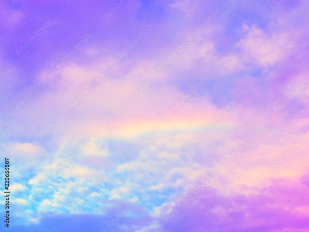 Beautiful rainbow with cloudy sky background.