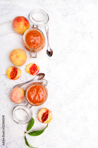 Homemade peach jam with organic fruit. Sweet preserves on a light background, , copy space
