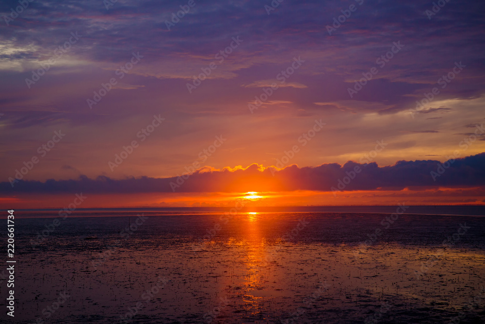 Wonderful dark silver and orange sea with sunset twilight sky in the evening time. scenery moment. spirit of serene and zen. image for background, wallpaper, interior, decorate and copy space. 