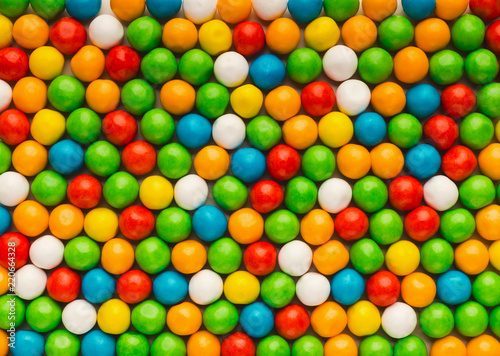 Mulicolored bonbons background photo