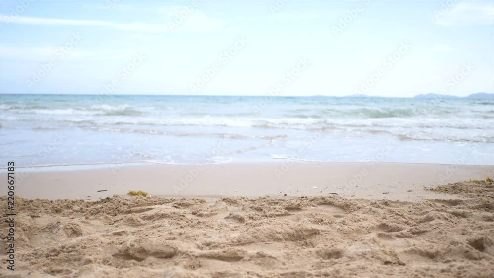 Slow motion scenic landscape of nature sea wave coast to beach with stone and rock for summer vacation concept Slow motion scenic landscape of nature sea wave coast to beach with stone and rock for summer vacation concept