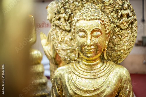 The golden Buddha statue.View of buddha statue in Thailand.Close up hand of statue Buddha.buddhism concept © anon