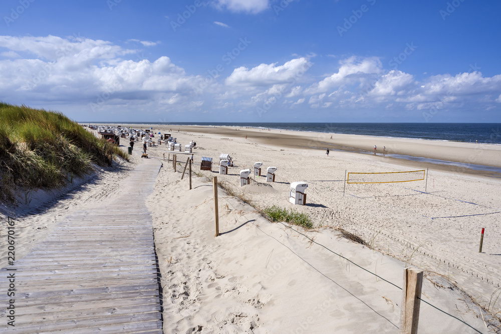 Germany, North Sea, Spiekeroog: Panorama view with people, beach chairs ...