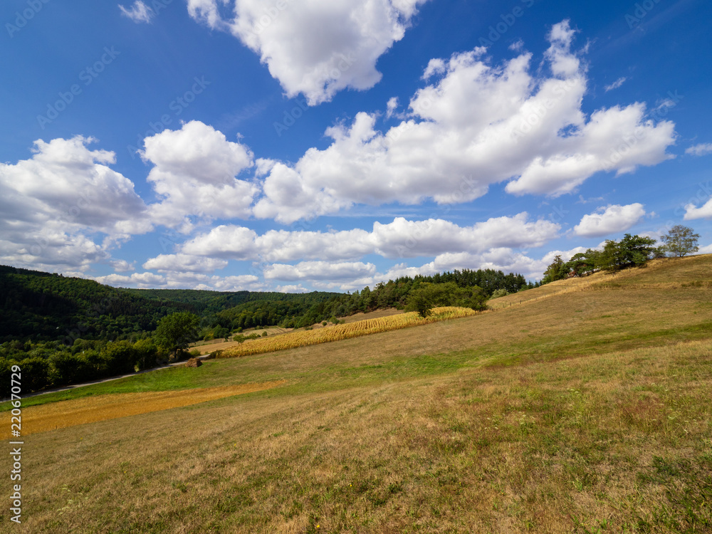Autumnal countryside view with clouds and blue sky Autumnal countryside view with clouds and blue sky