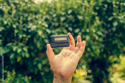pagers. old vintage beeper. pager in hand photo