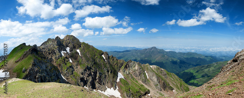 view of Pyrenees mountains with cloudy blue sky