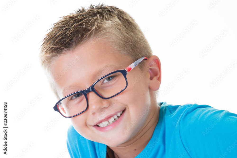 portrait little child boy in blue shirt and glasses smiling happy
