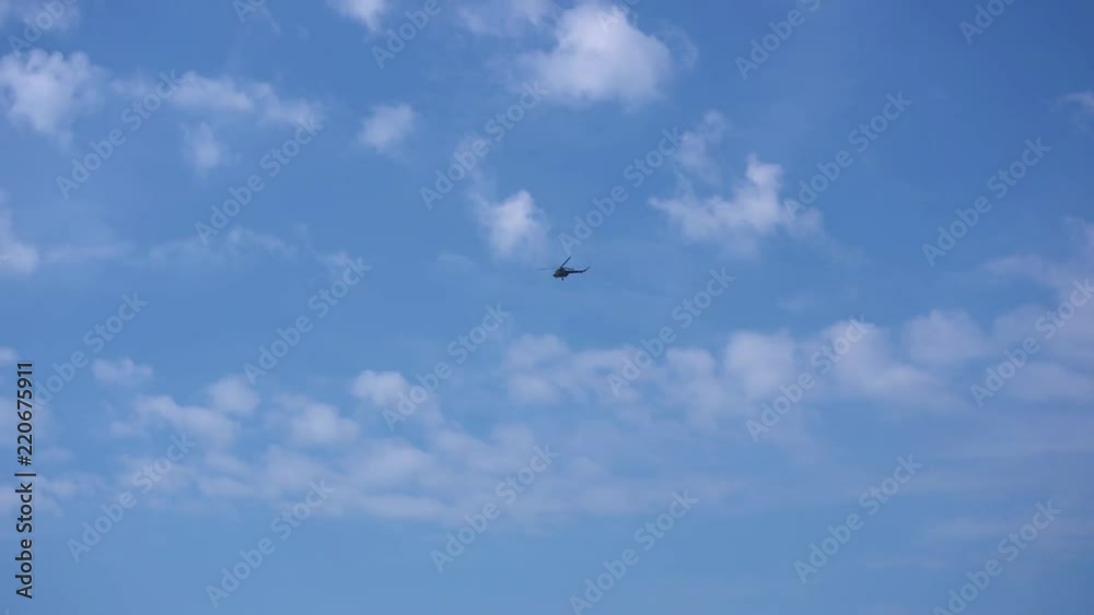 the helicopter is flying in the sky the helicopter is flying in the sky