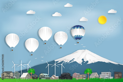 The hot air balloons travel over Fuji mountain in Japan and countryside on blue sky as trip in the holiday , paper art and craft style concept. vector illustration.