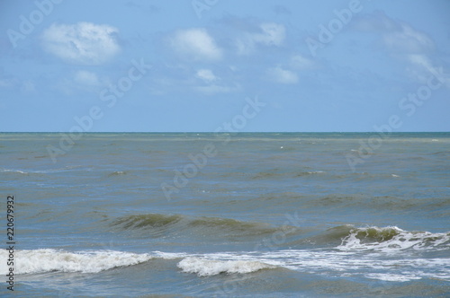 landscape of sea and water surf to beach in sunshine day