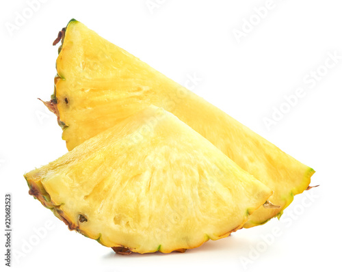 slices of ripe pineapple fruit isolated on white background
