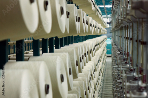 Industrial textile factory. Coils with threads in production.Fabric production .