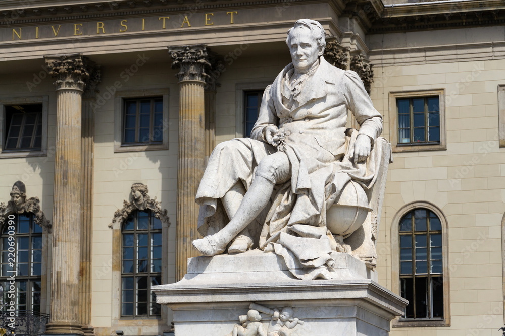 Alexander von Humboldt statue outside Humboldt University from 1883 by Reinhold Begas, Berlin, Germany, sunny day