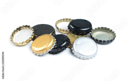 Beer bottle caps on white background