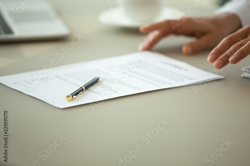Offering to sign contract concept, businesswoman proposing reading terms conditions of business paper deal, legal sale purchase document for bank loan, insurance services or employment close up view
