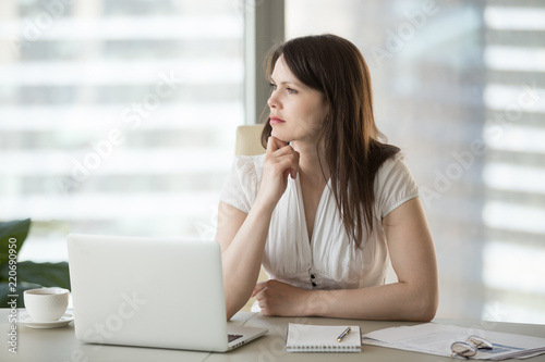 Thoughtful doubtful businesswoman looking away contemplating thinking of problem solution, serious uncertain employee unsure about difficult question deciding planning searching new ideas at work © fizkes