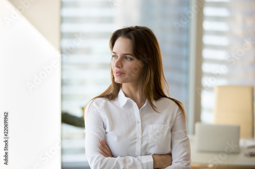 Free Download Thoughtful successful motivated businesswoman looking away dreaming of future in office, confident millennial female boss thinking about business vision enjoying success or planning new goals - GFXLoad
