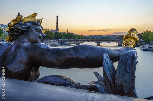 Statue on Pont Alexandre III bridge in Paris with a View of Seine River and Eiffel Tower