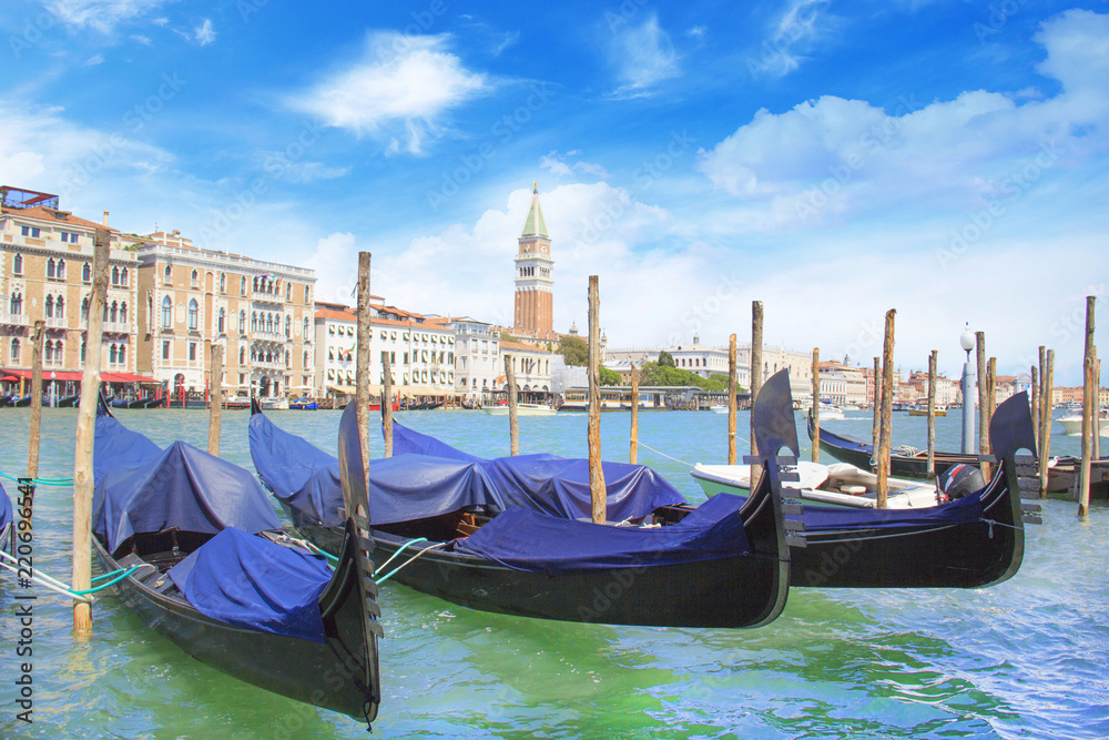 Beautiful view of the gondola and bell tower of Campanella in the Venetian lagoon, Venice, Italy