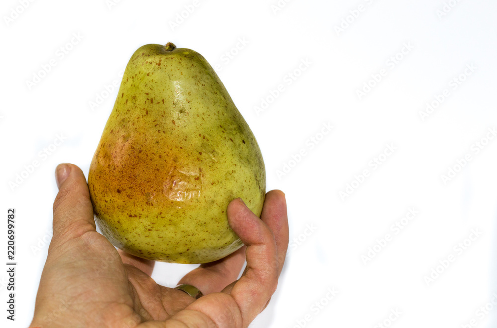 Pear in hand isolated on white background. Pear in hand isolated on white background.