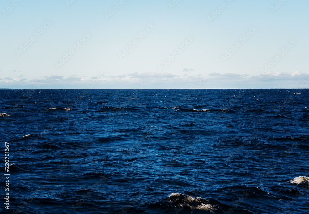 Naklejka premium The sea of Ladoga lake from the boat. Turbulent sea. Ripples and small waves.