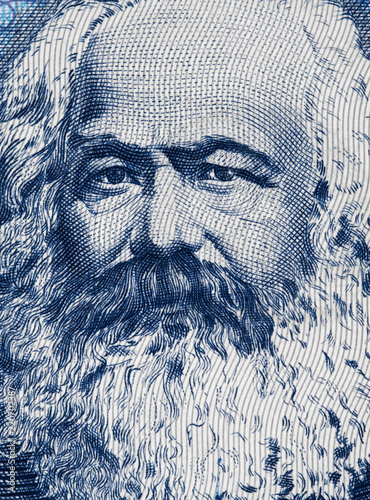 Karl Marx portrait on East German 100 mark (1975) banknote closeup macro, famous philosopher, economist, political theorist, sociologist and revolutionary socialist..