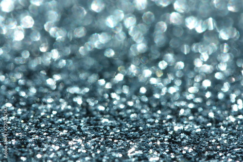Blue glitter background. Christmas, New Year, party or festive background.