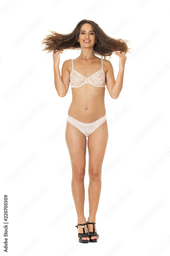 Full length beautiful slim tanned woman in bikini, isolated on white background Full length beautiful slim tanned woman in bikini, isolated on white background