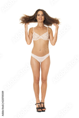 Full length beautiful slim tanned woman in bikini, isolated on white background © Andrey_Arkusha