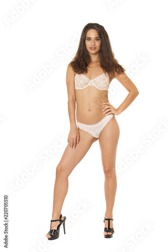 Full length beautiful slim tanned woman in bikini, isolated on white background